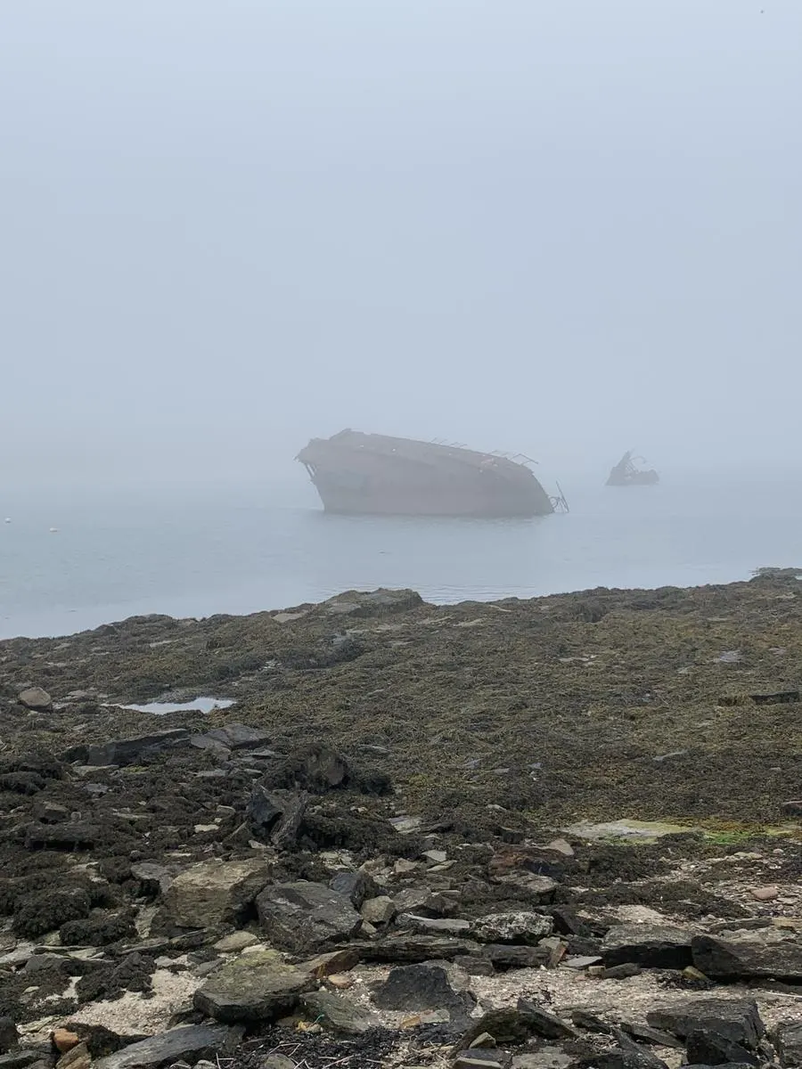 Wreck of the WWI blockship SS Reginald lying in Weddell Sound, Scapa Flow, close to Churchill Barrier number 3. In Souls of Scapa Flow, Laura Matson and Callum Craigie drive past the SS Reginald on their way from St. Margaret's Hope to Kirkwall.